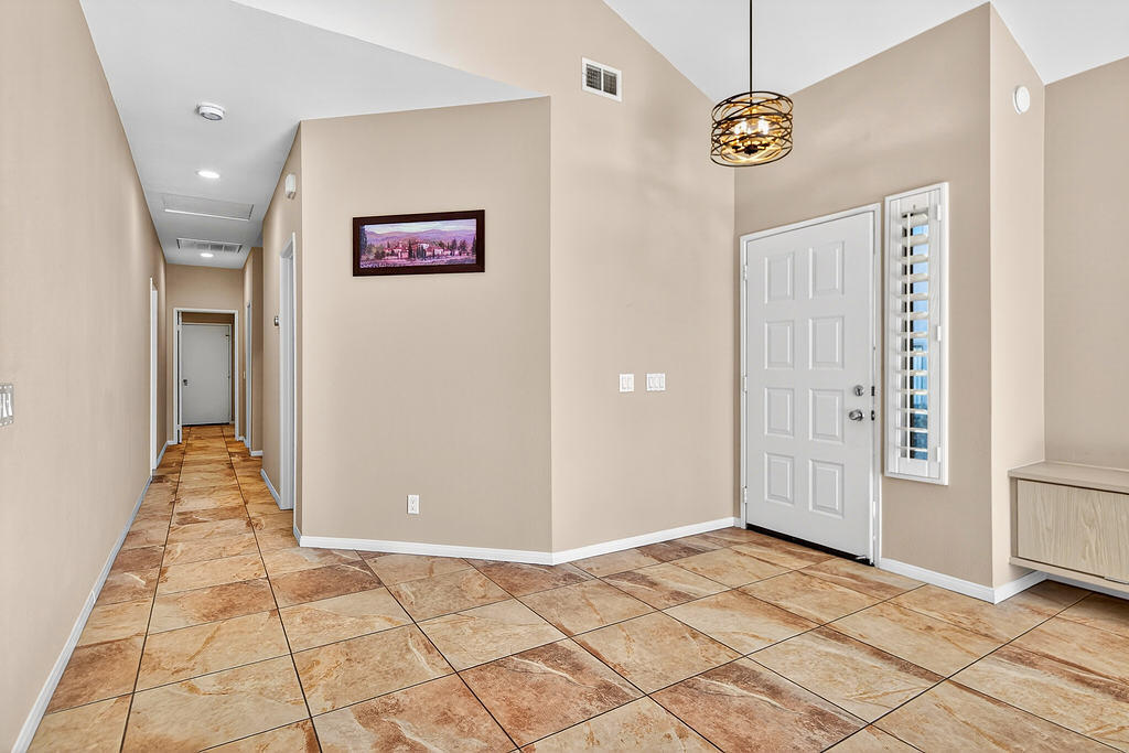 38019 Crocus Lane Palm Desert, CA 92211 - Photo 20 of 28 a view of a hallway with a chandelier fan