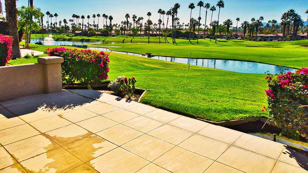 38019 Crocus Lane Palm Desert, CA 92211 - Photo 22 of 28 a park view with a bench and a play ground