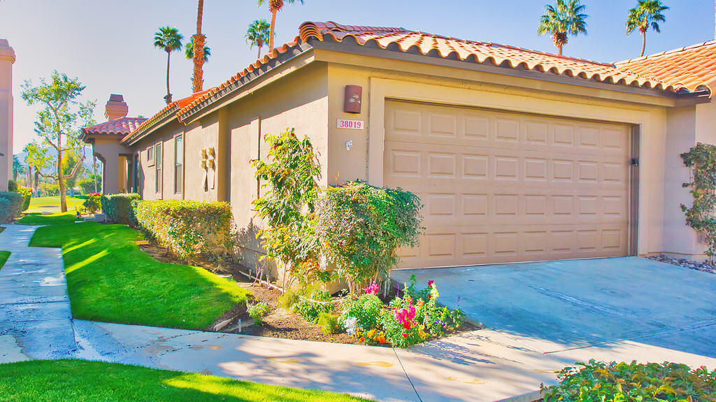 38019 Crocus Lane Palm Desert, CA 92211 - Photo 26 of 28 a front view of a house with a yard