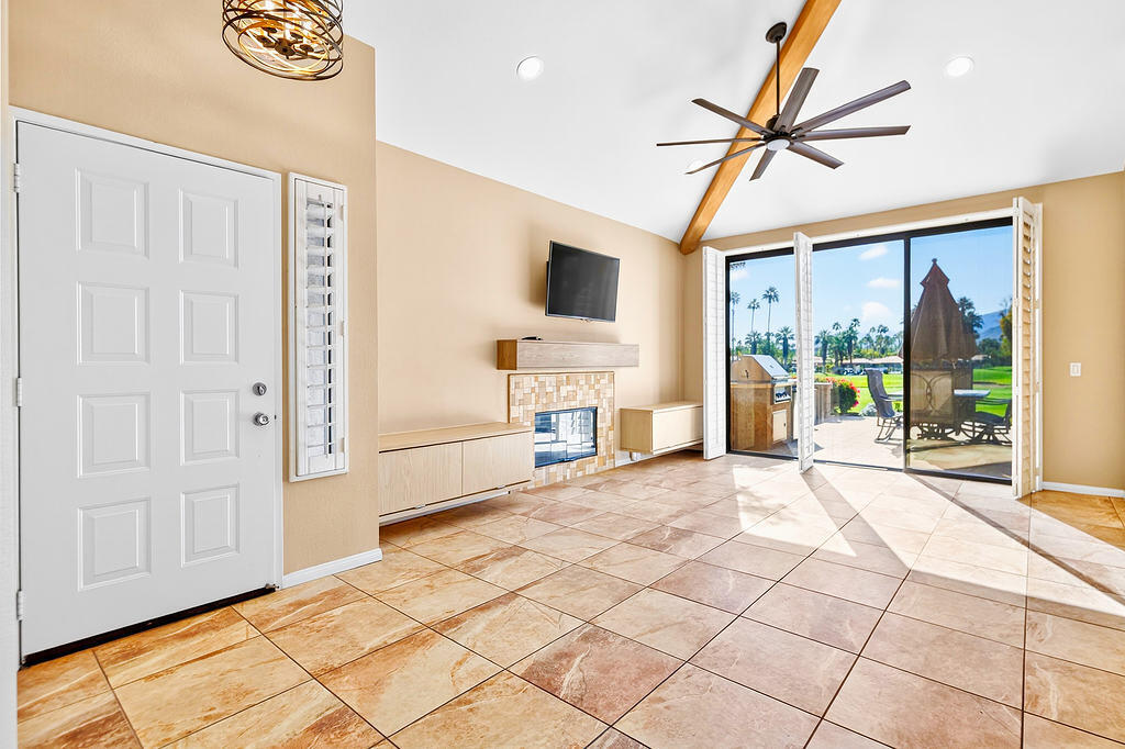 38019 Crocus Lane Palm Desert, CA 92211 - Photo 7 of 28 a room with a bed and a flat screen tv