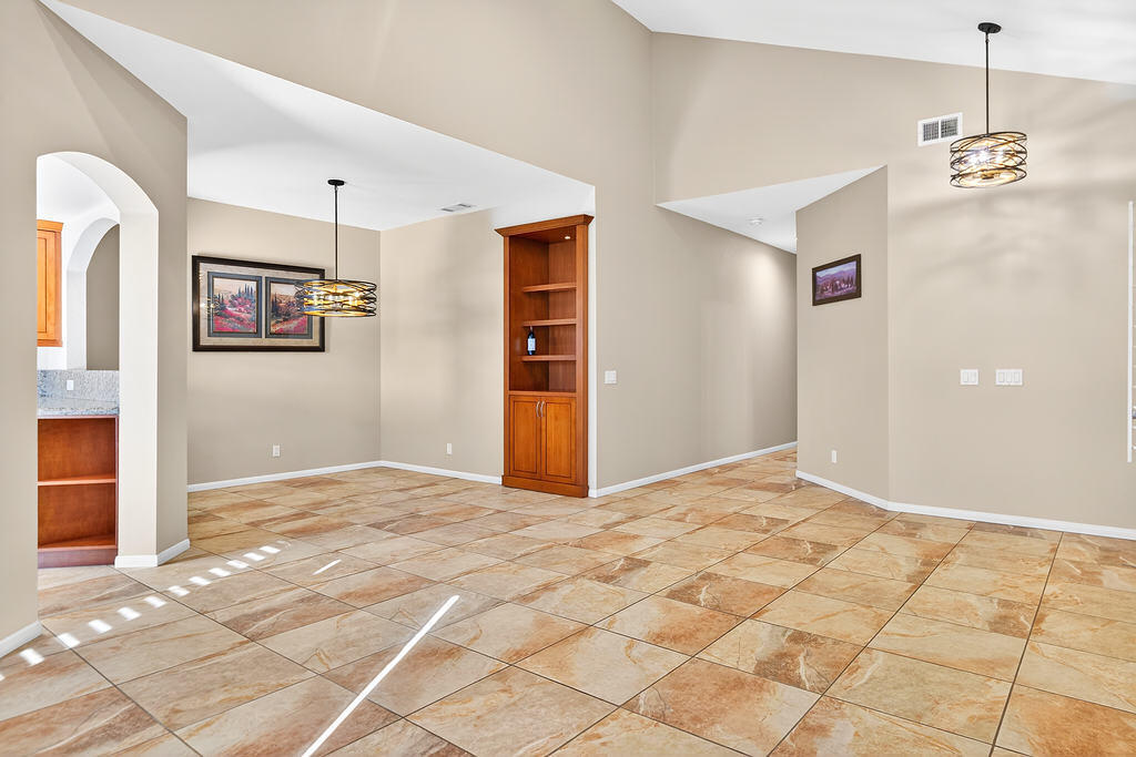 38019 Crocus Lane Palm Desert, CA 92211 - Photo 8 of 28 a view of a livingroom with wooden floor and a chandelier