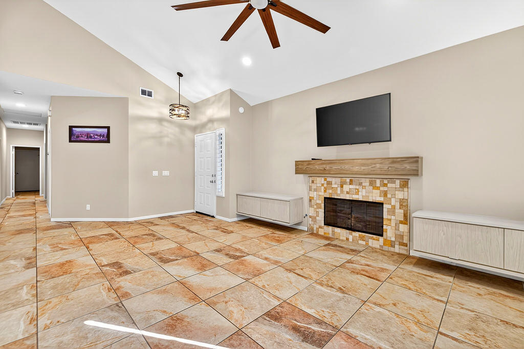 38019 Crocus Lane Palm Desert, CA 92211 - Photo 9 of 28 a view of an empty room with a fireplace and a window