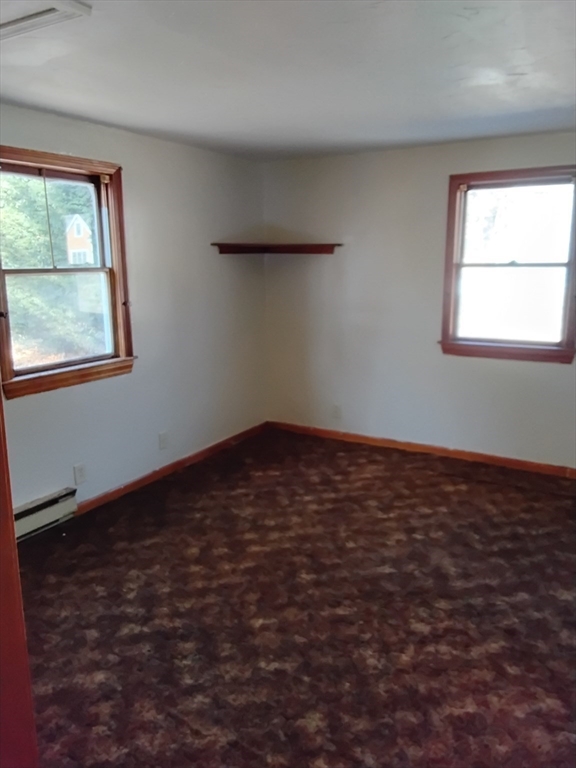 419 Spring Street Hanson, MA 02341 - Photo 11 of 26 an empty room with a window