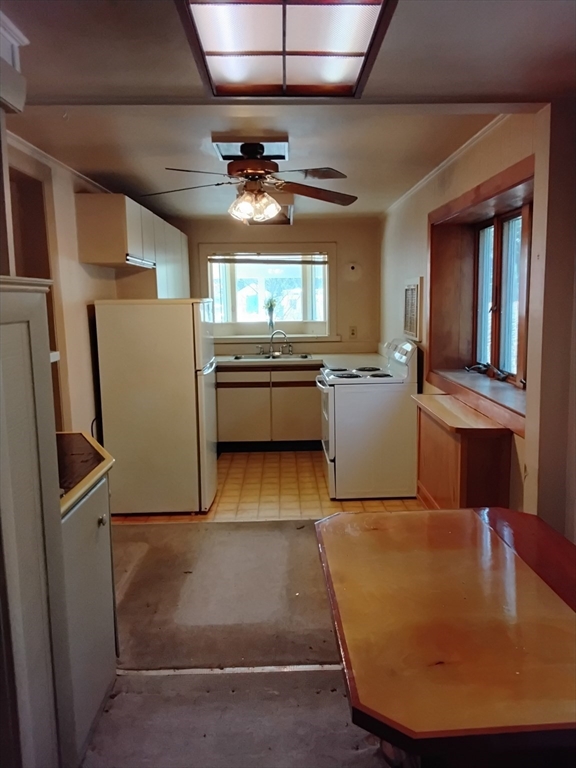 419 Spring Street Hanson, MA 02341 - Photo 13 of 26 a kitchen with sink refrigerator and window