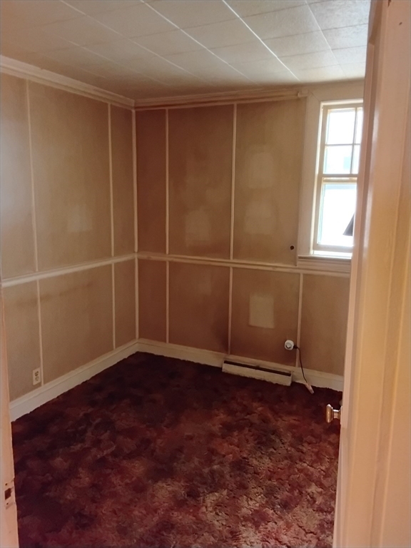 419 Spring Street Hanson, MA 02341 - Photo 16 of 26 an empty room with cabinet and windows