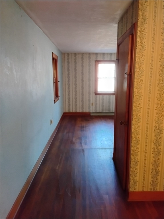 419 Spring Street Hanson, MA 02341 - Photo 19 of 26 a view of a room with wooden floor and a window