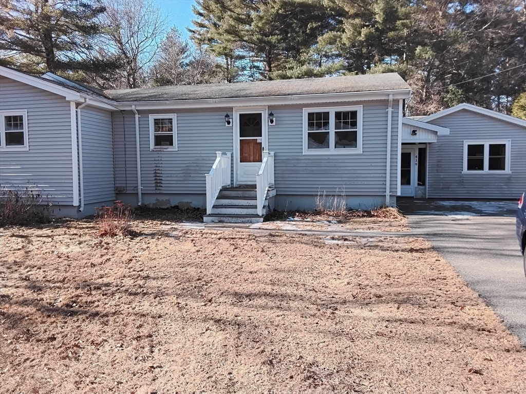 419 Spring Street Hanson, MA 02341 - Photo 2 of 26 a view of a house with a yard