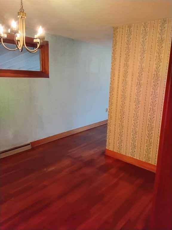 419 Spring Street Hanson, MA 02341 - Photo 22 of 26 a view of wooden floor and windows in a room