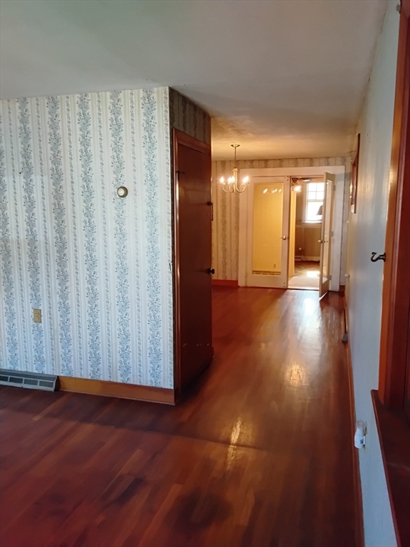 419 Spring Street Hanson, MA 02341 - Photo 25 of 26 a view of a hallway with wooden floor