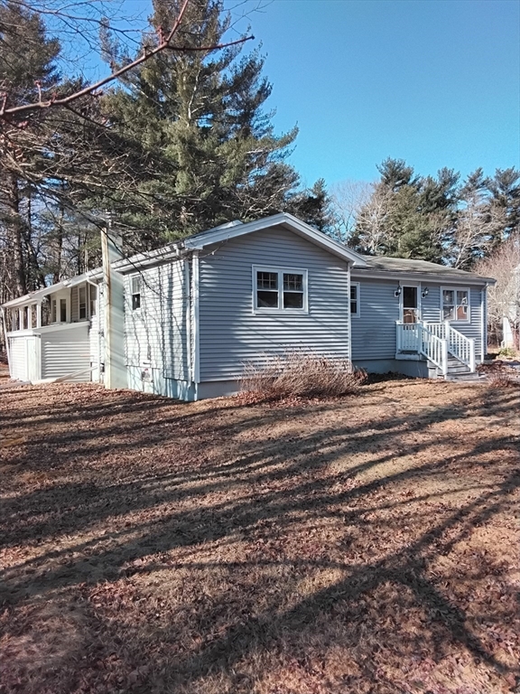 419 Spring Street Hanson, MA 02341 - Photo 3 of 26 a view of a house with a patio