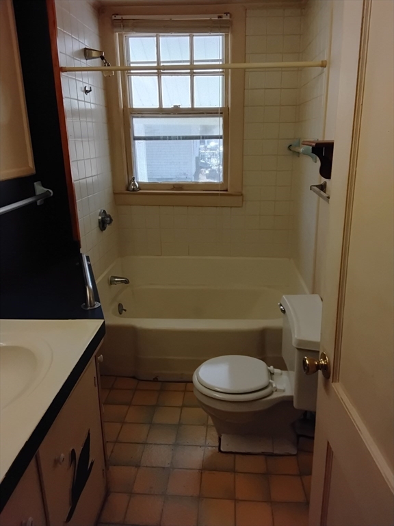 419 Spring Street Hanson, MA 02341 - Photo 9 of 26 a bathroom with a sink a toilet and a bathtub
