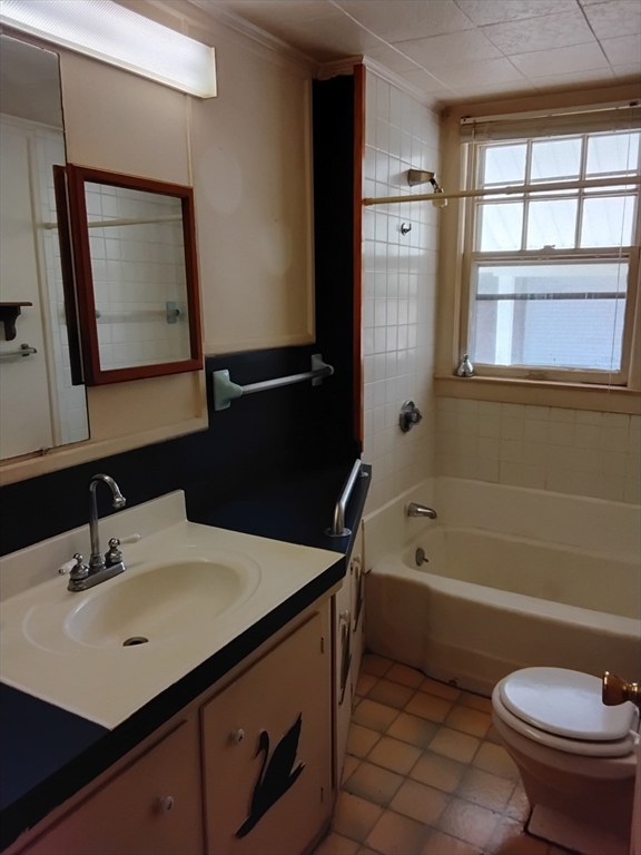 419 Spring Street Hanson, MA 02341 - Photo 10 of 26 a bathroom with a sink a toilet and a bathtub