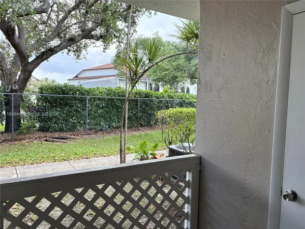 a view of a yard from a balcony