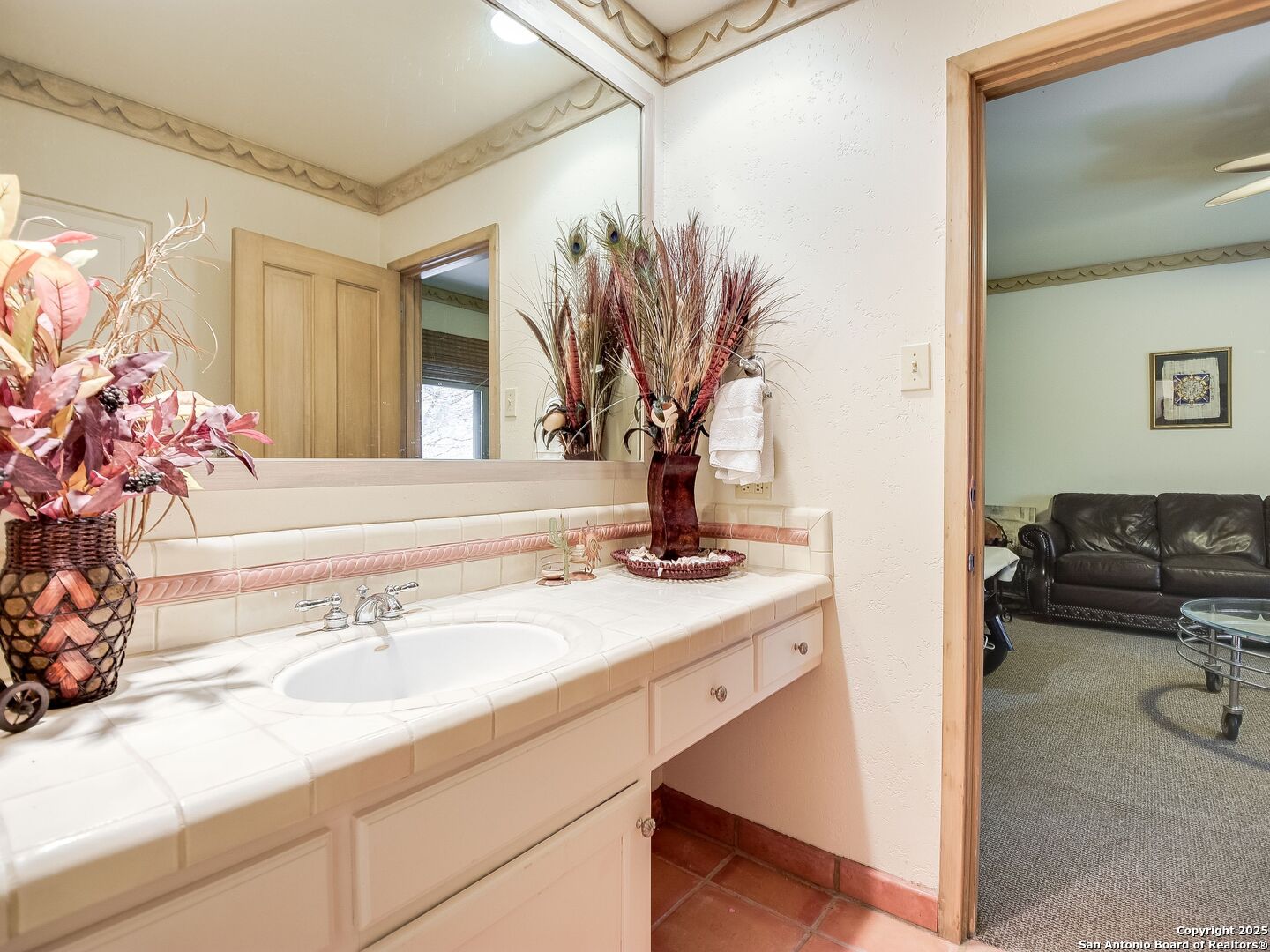 110 Axis Circle Boerne, TX 78006 - Photo 18 of 29 a en suite bathroom with a granite countertop sink a mirror and a shower