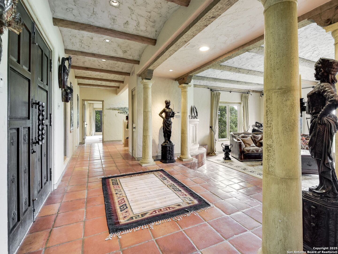 110 Axis Circle Boerne, TX 78006 - Photo 4 of 29 a view of a hallway with a couch and a chandelier