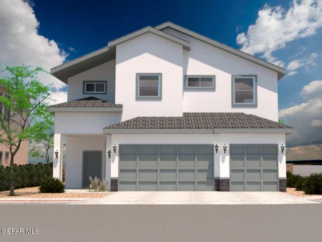 a front view of a house with a garage