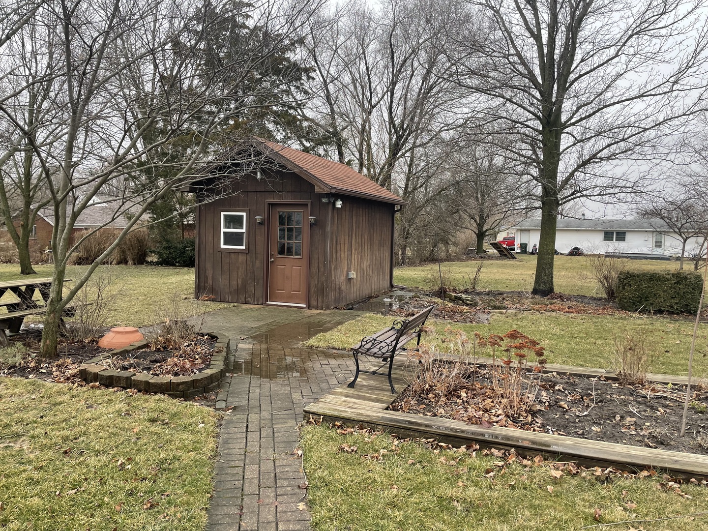 205 North 3rd Street Danforth, IL 60930 - Photo 17 of 17 a view of a wooden house with a yard covered with snow