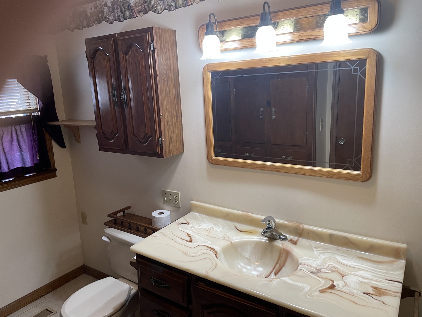 205 North 3rd Street Danforth, IL 60930 - Photo 10 of 17 a bathroom with a sink vanity and mirror