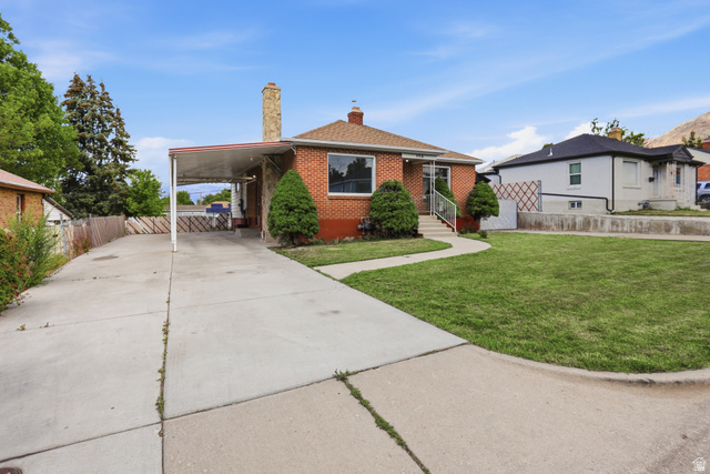 774 37th Street South Ogden, UT 84403 - Photo 35 of 47 Brick facade residence with a gabled roof and stone chimney