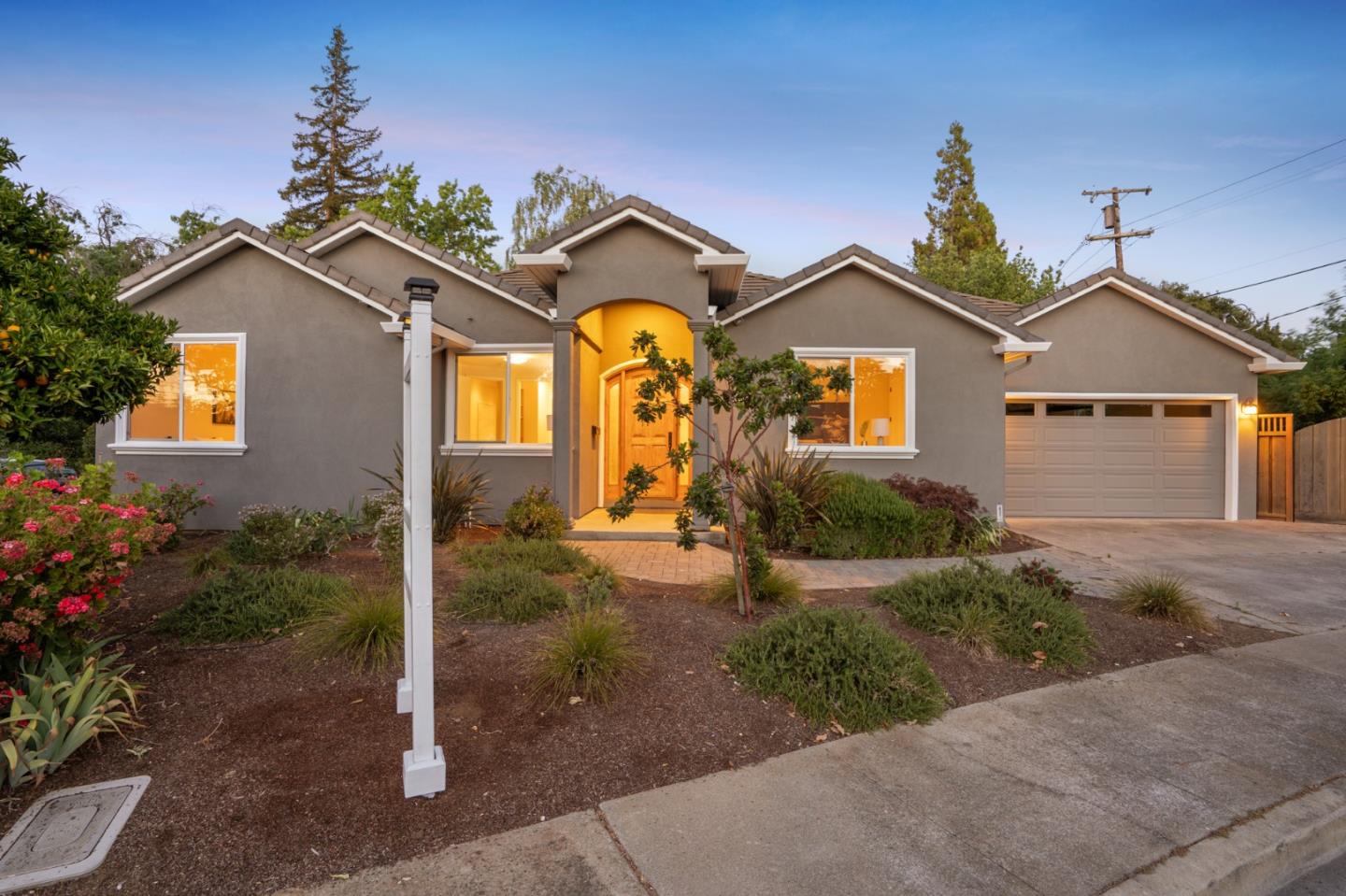 a front view of a house with garden