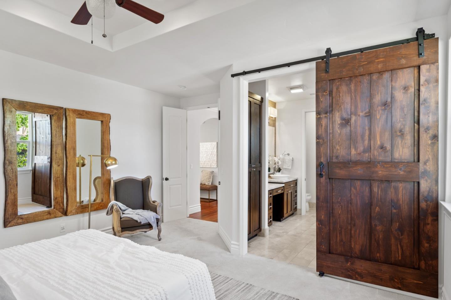 1161 Morton Court Mountain View, CA 94040 - Photo 17 of 33 a spacious bedroom with a bed and a chandelier