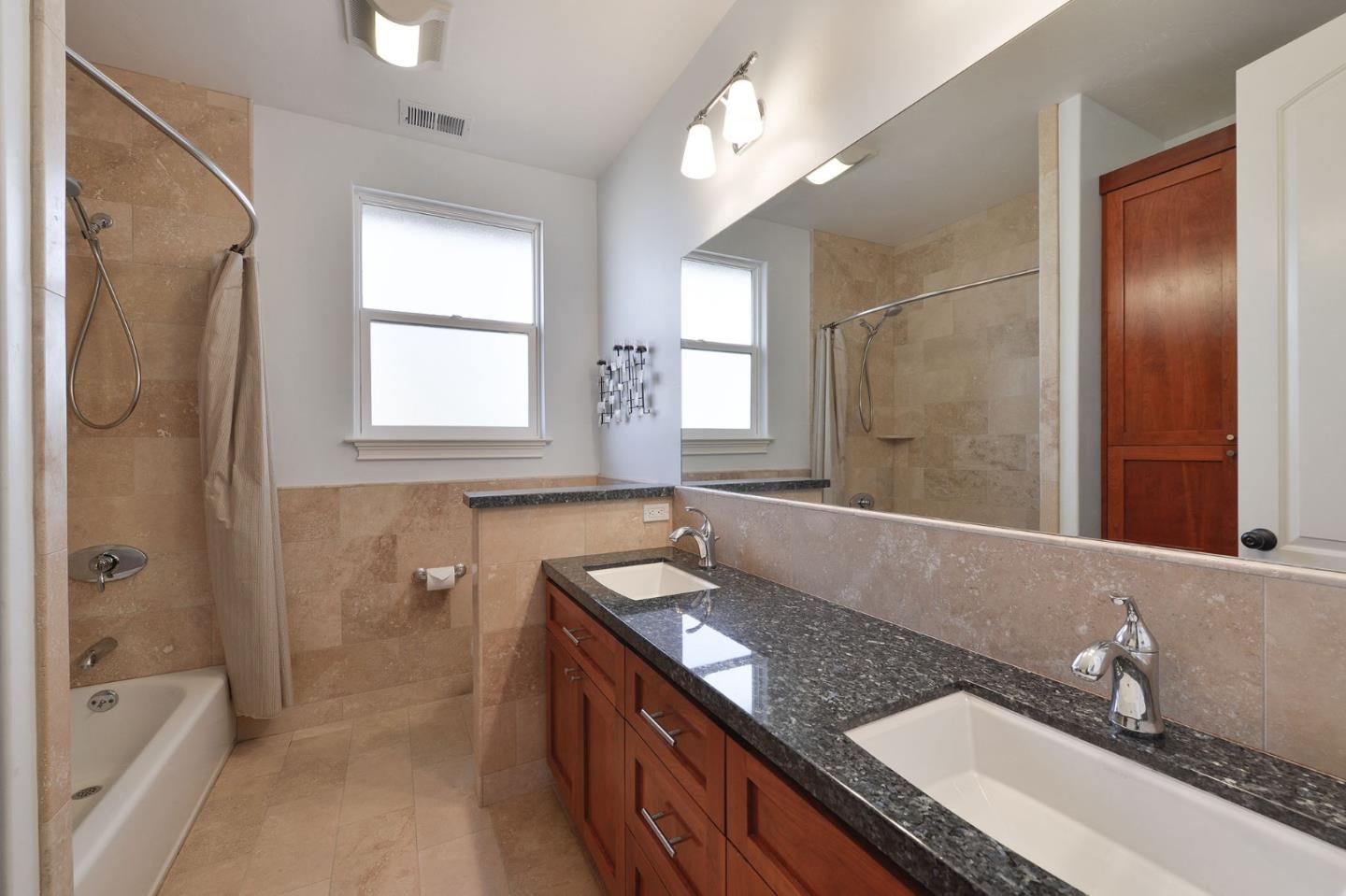 1161 Morton Court Mountain View, CA 94040 - Photo 24 of 33 a bathroom with a granite countertop sink mirror and a bathtub