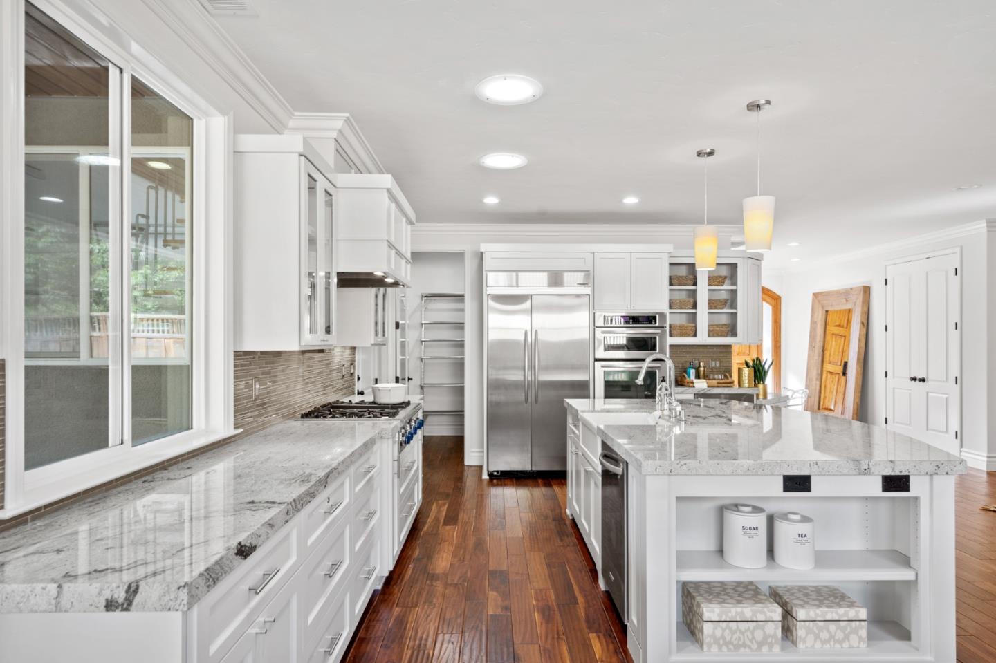 1161 Morton Court Mountain View, CA 94040 - Photo 9 of 33 a large kitchen with kitchen island a large counter space a sink stainless steel appliances and cabinets