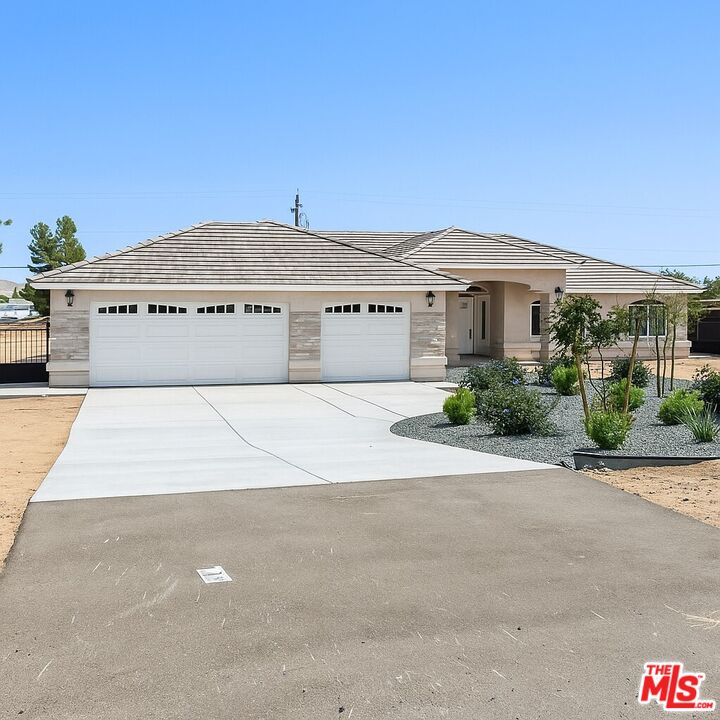 13033 Casco Road Apple Valley, CA 92308 - Photo 1 of 14 a large building with a street