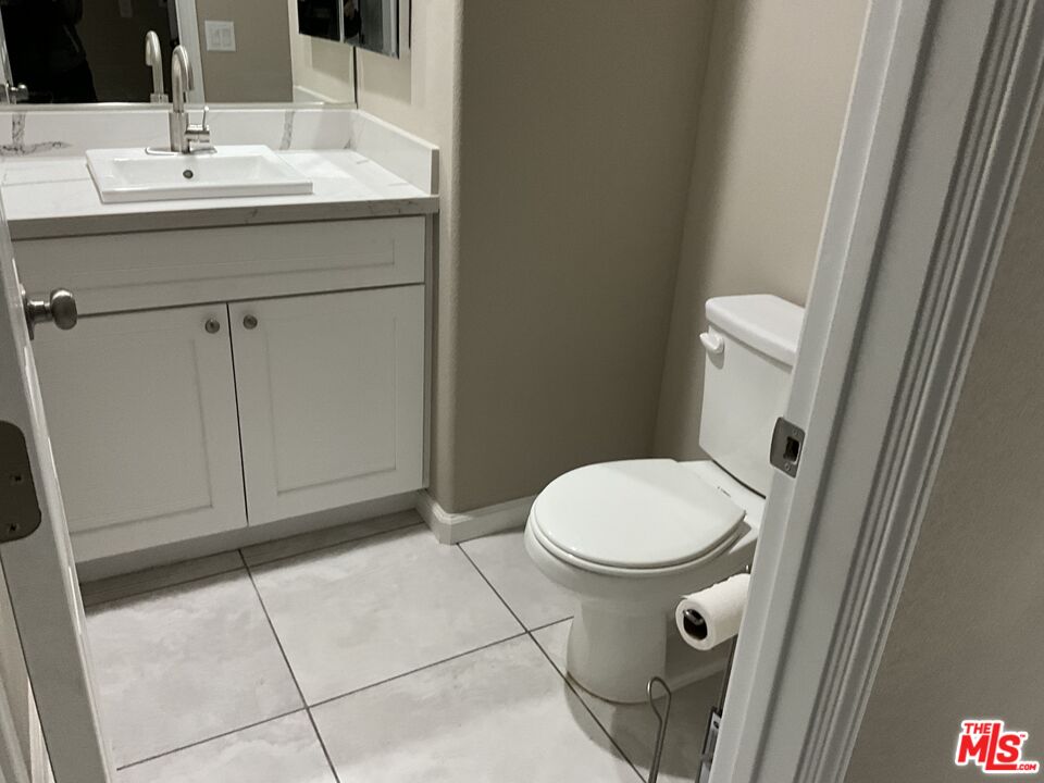 13033 Casco Road Apple Valley, CA 92308 - Photo 13 of 14 a bathroom with a sink and a toilet
