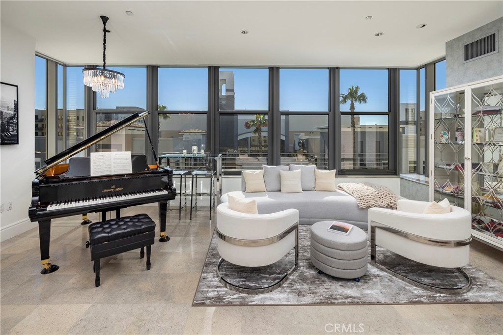 345 East Colorado Boulevard, Unit 404 Pasadena, CA 91101 - Photo 11 of 57 a living room with furniture and a rug