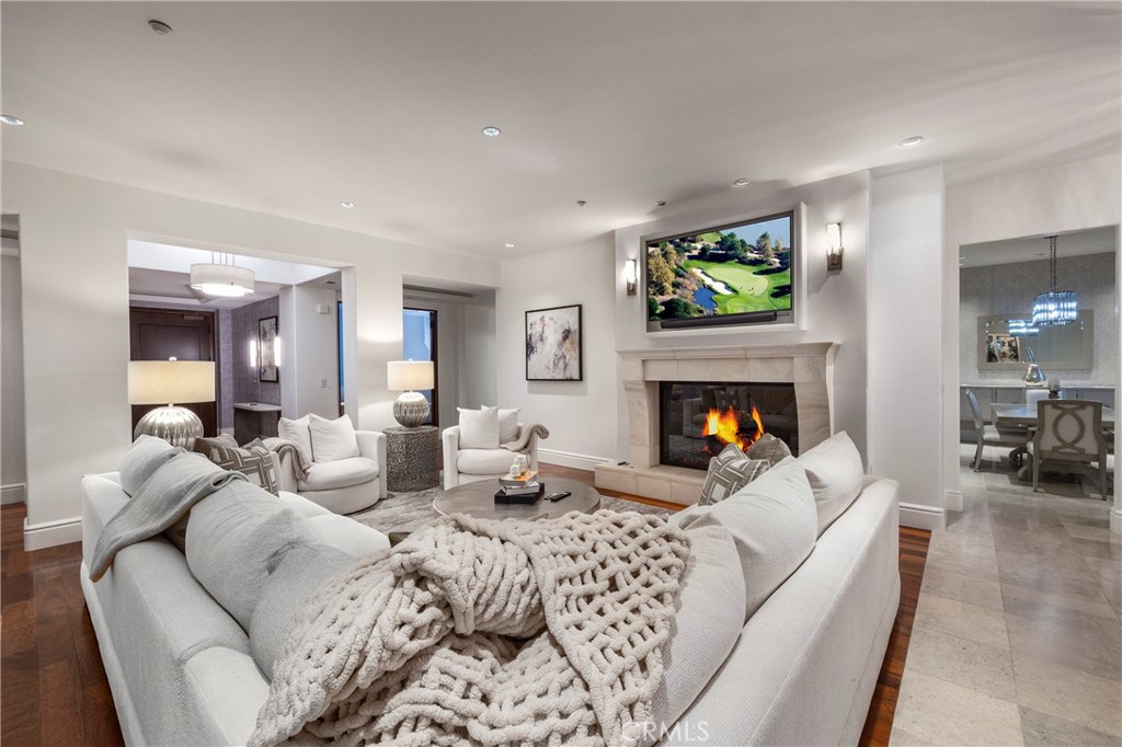 345 East Colorado Boulevard, Unit 404 Pasadena, CA 91101 - Photo 13 of 57 a living room with furniture and a fireplace