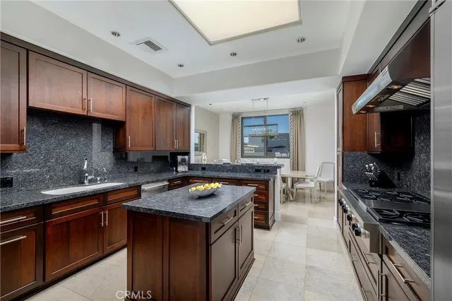 a stove top oven sitting inside of a kitchen