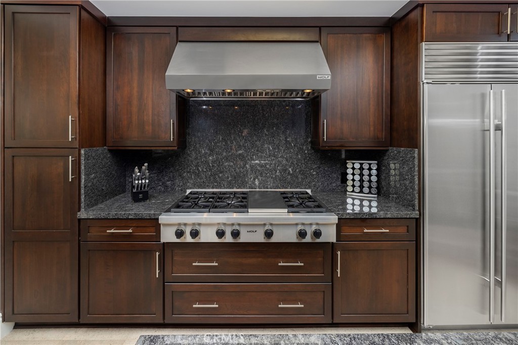 345 East Colorado Boulevard, Unit 404 Pasadena, CA 91101 - Photo 19 of 57 a stove top oven sitting inside of a kitchen