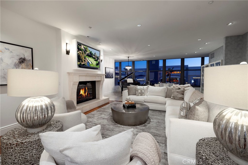 345 East Colorado Boulevard, Unit 404 Pasadena, CA 91101 - Photo 3 of 57 a living room with furniture and a fireplace