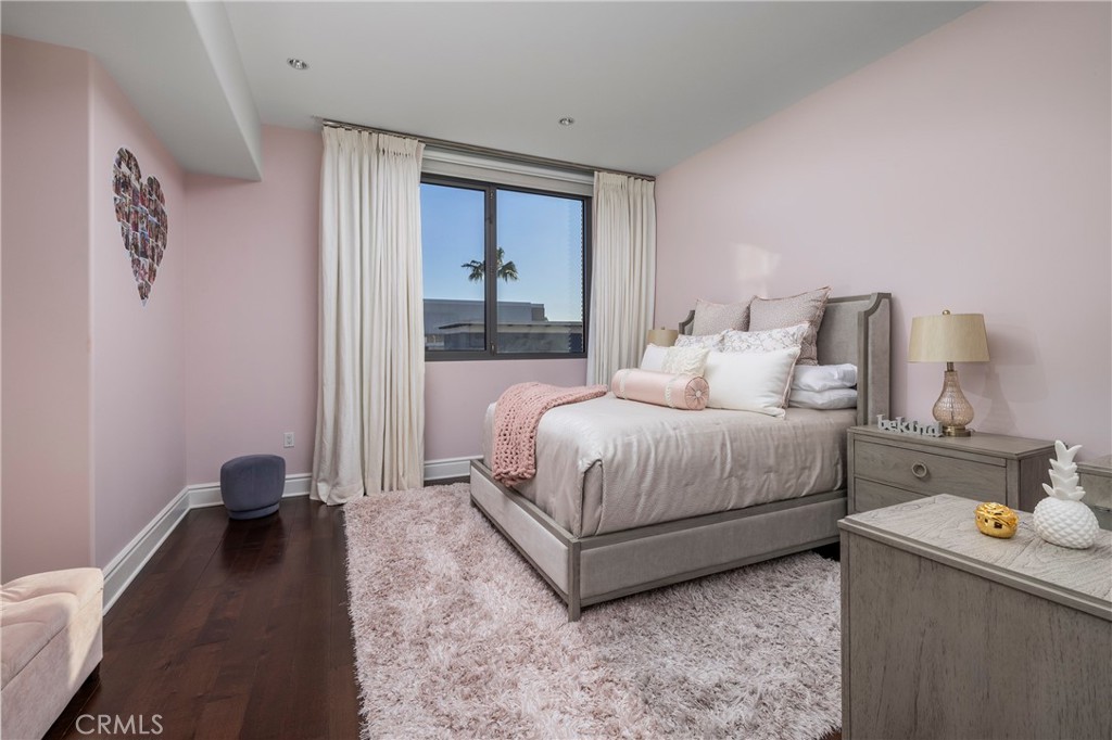 345 East Colorado Boulevard, Unit 404 Pasadena, CA 91101 - Photo 33 of 57 a bedroom with a bed and view of living room