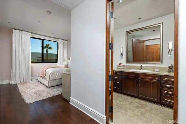 a view of hallway with wooden floor