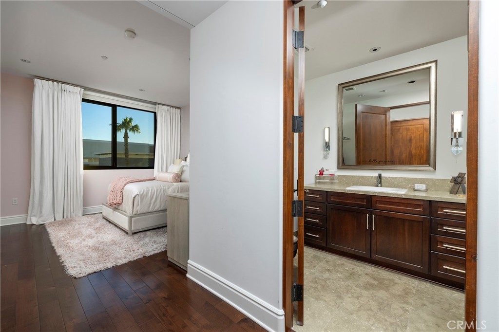 345 East Colorado Boulevard, Unit 404 Pasadena, CA 91101 - Photo 36 of 57 a en suite bathroom with a granite countertop tub and a large mirror