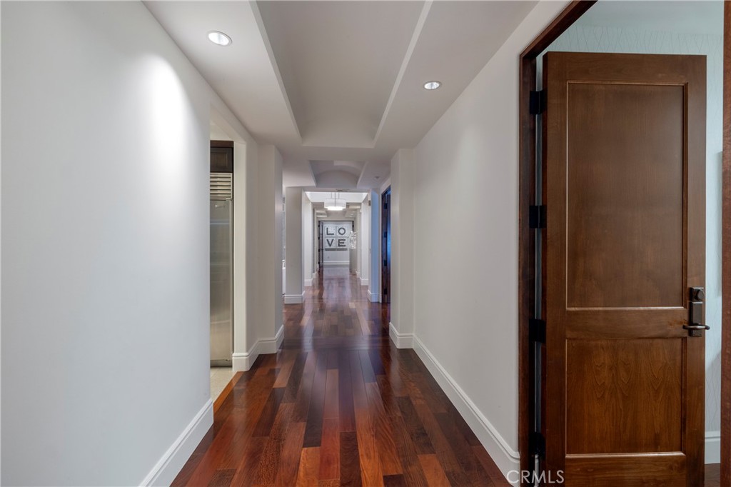 345 East Colorado Boulevard, Unit 404 Pasadena, CA 91101 - Photo 41 of 57 a view of hallway with wooden floor