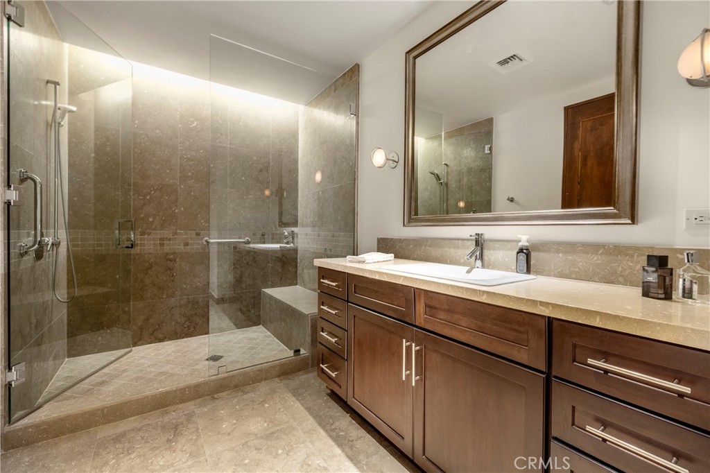 345 East Colorado Boulevard, Unit 404 Pasadena, CA 91101 - Photo 48 of 57 a bathroom with a sink and a mirror