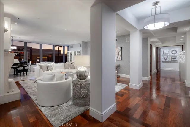 a living room with furniture fireplace and a flat screen tv