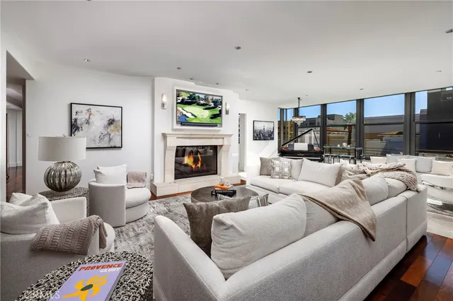 a living room with furniture and a rug
