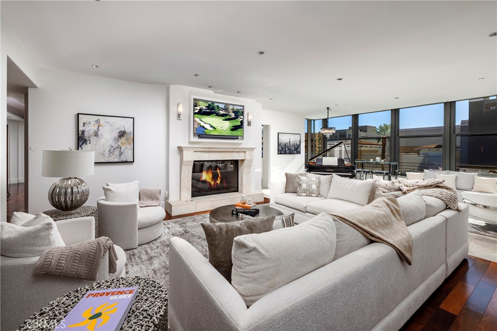 345 East Colorado Boulevard, Unit 404 Pasadena, CA 91101 - Photo 10 of 57 a living room with furniture fireplace and a flat screen tv