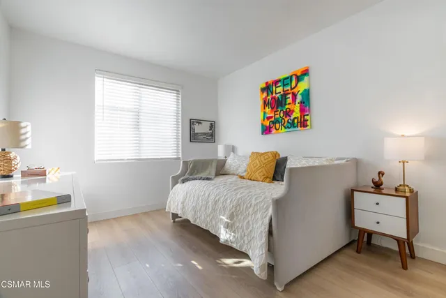 a bed room with a bed and a desk