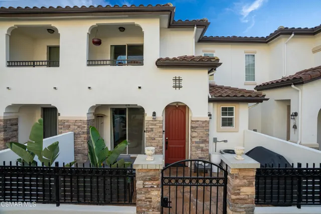 a front view of a house with glass windows