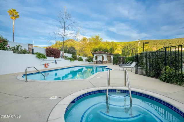 a view of a swimming pool with a patio