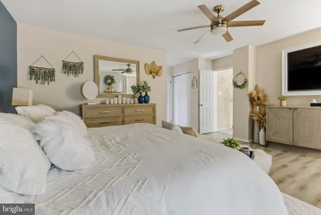 a spacious bathroom with a sink a mirror and a bathtub