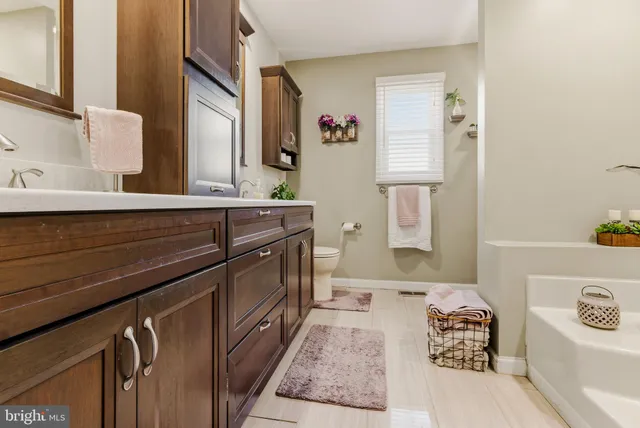 a bathroom with a bathtub and sink