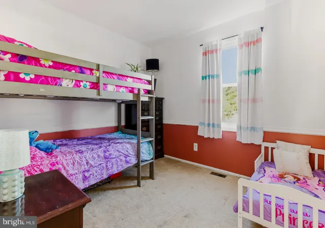 a bedroom with furniture and a chandelier