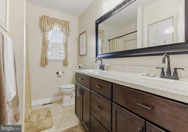 a view of a garden with a building in the background