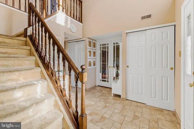 a view of living room filled with furniture and floor to ceiling window